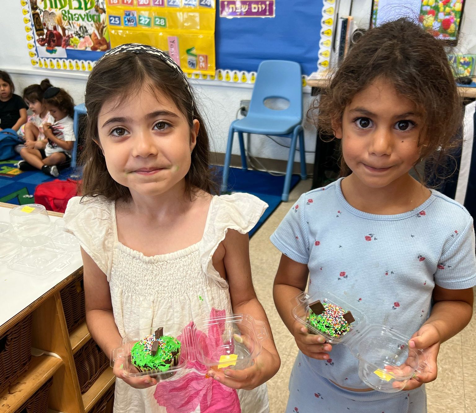 Creating Har Sinai Cupcakes in Nursery 3 in honor of Shavuot!